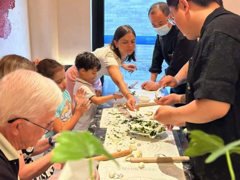 Beijing: Dumpling Making Workshop with Meal and Tea - The communal dinner: tea pairing, extra dishes, and beer