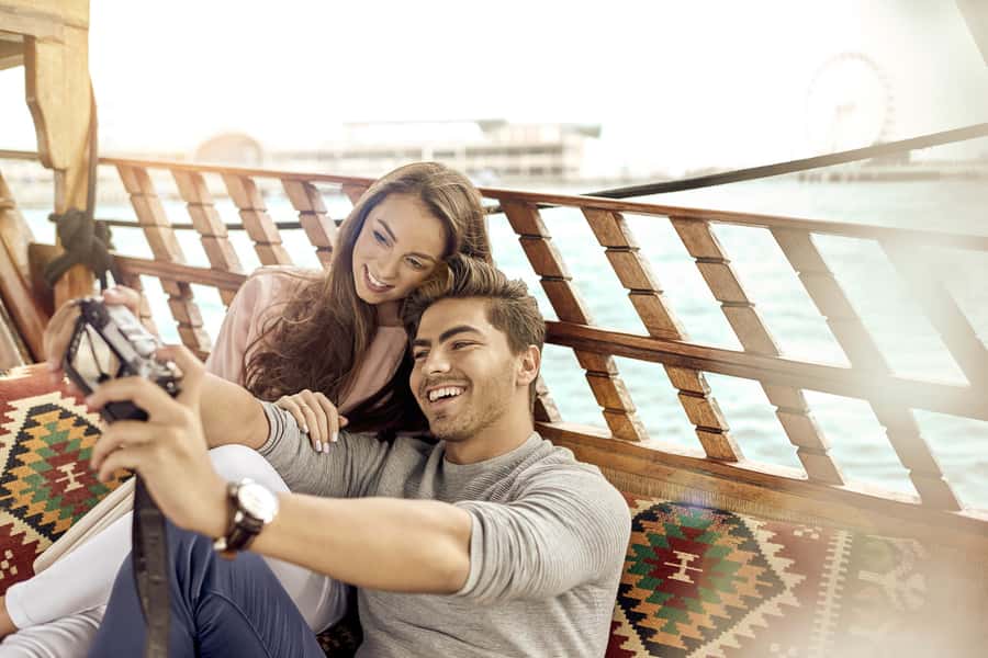 Dubai: Sunset Cruise on Traditional Boat & Emirati High Tea - Boarding the Abra: comfort, vibe, and a surprisingly classic Dubai moment