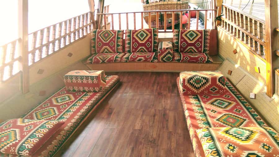 Dubai: Sunset Cruise on Traditional Boat & Emirati High Tea - Dubai Canal views: bird sanctuary, dhow yards, and old-vs-new framing