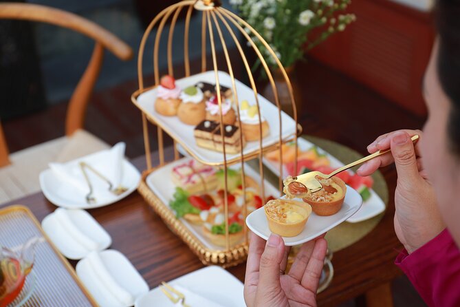 Huong River Afternoon Tea Cruise Tour Along Hue City - Comfort and Weather: How to Plan for a Rainy Hue Afternoon