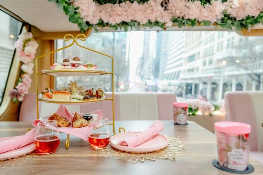 NYC: Tea Around Town Bus Tour with Live Entertainment - Your pink teahouse bus and Midtown starting point
