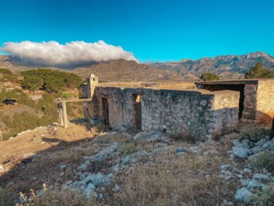 Pigadia: Agia Kyriaki Guided Hike with Coffee/Tea and Raki - The climb toward Agia Kyriaki: barns, olive fields, and Aegean views